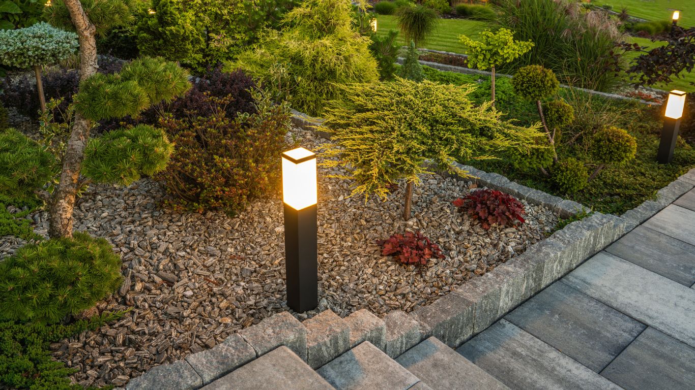 A garden with modern landscape lighting, showcasing the benefits of landscape lighting for beauty and security.