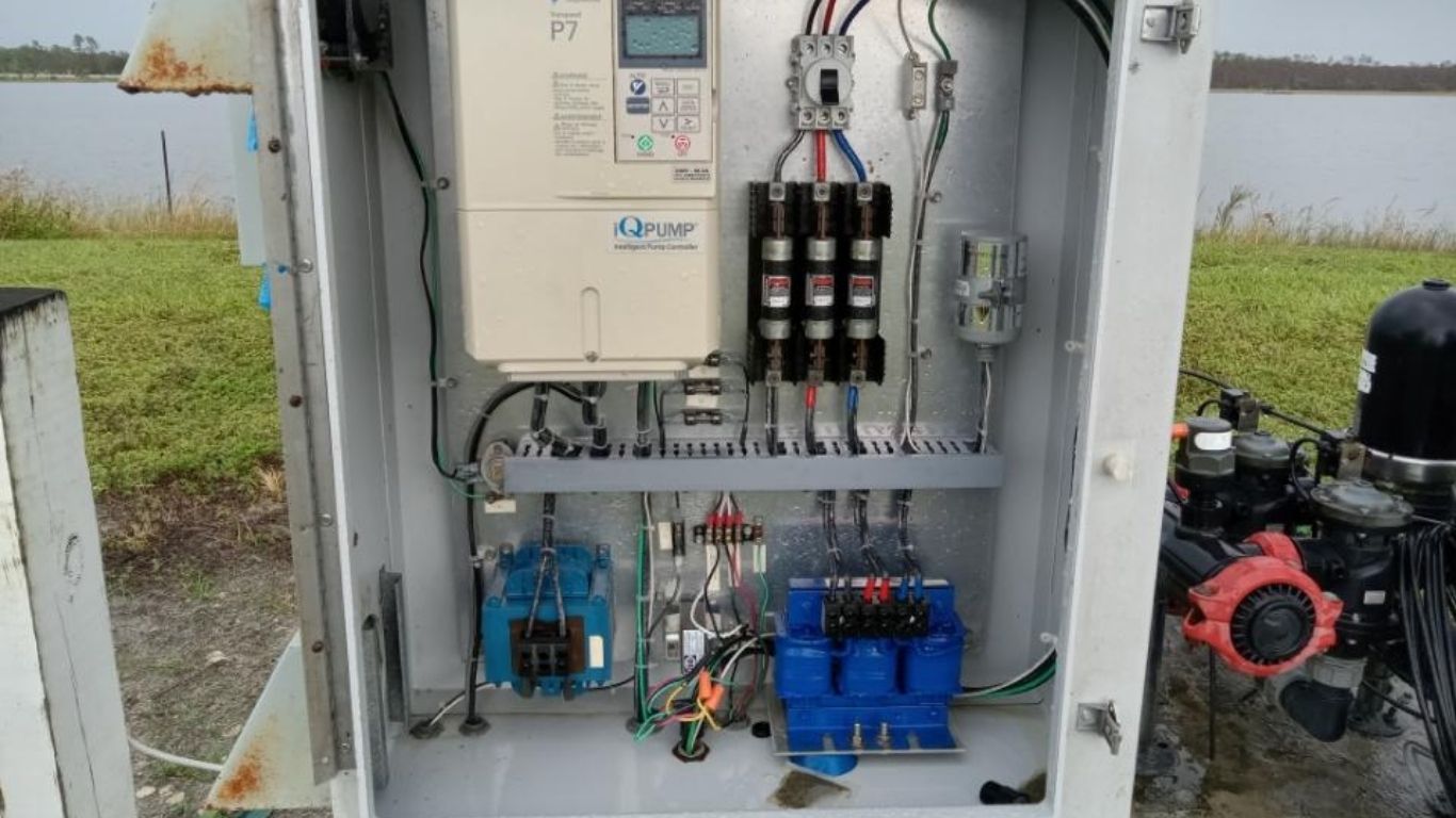 Outdoor pump control panel demonstrating professional irrigation system programming for efficient lawn care.